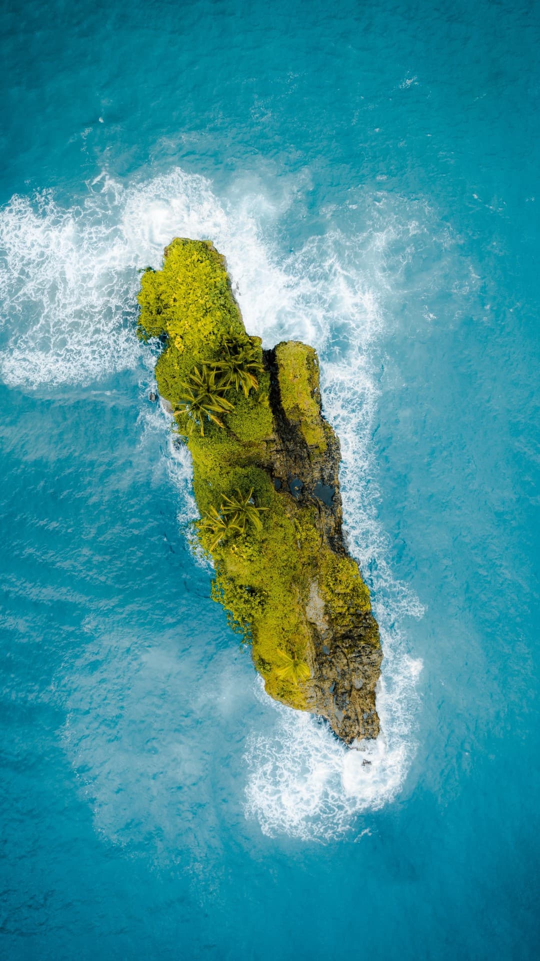 Aerial shot of beautiful little island in the middle of the ocean